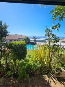 a view of the garden from the living room at Marine View in Plettenberg Bay