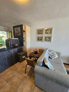 a living room with a couch and a table at Marine View in Plettenberg Bay