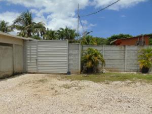 a house with a gate and a fence at Conchal Maquito House in Brasilito