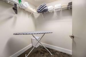 a walk in closet with a table and towels at The West End Flats Hotel in Roanoke