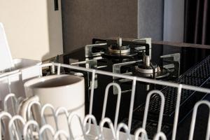 a stove with four burners on top of it at 大阪難波リバーサイドガーデンホテルOsaka Namba River Side Garden Hotel in Osaka +126 photos