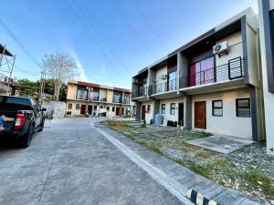 a car parked in front of a building at Cozy Cove in Baclayon