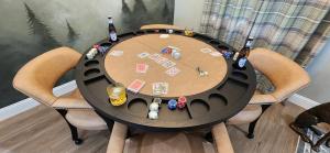 a table with two chairs and bottles of beer at The fancy Shanty in Pilot Hill +20 photos