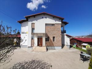 a large white building with a red roof at MIRANA-Marginimea Sibiului in Cristian
