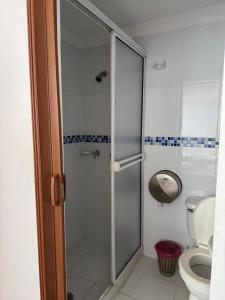 a bathroom with a shower and a toilet at Hotel Cielo de Tambores in Cali +45 photos