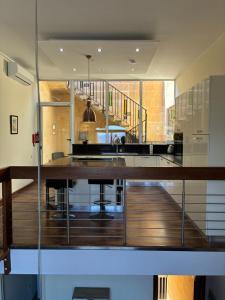 a kitchen with a large wooden island in a house at Fort Chambray Island Views in Għajnsielem
