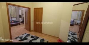 a view of a living room with a bedroom at Абай2 103 in Astana