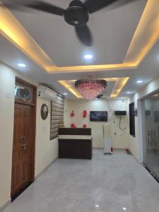 a room with a ceiling with a ceiling fan at Hotel Galaxy in Mundarwa