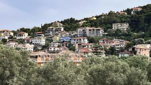 a group of houses on top of a hill at Ionian Bay Studios in Lefkada