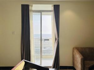 a room with a window with a view of the ocean at Sea Paradise in Cox's Bazar