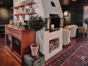 a living room with a fireplace in a room at Hotell Miskarp in Mjölby