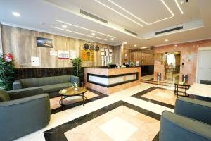 a lobby of a hotel with couches and tables at فندق النخبة الماسي - Diamond Elite Hotel in Medina