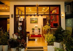 an entrance to a store with potted plants at Diva Villa Airport Transit Hotel in Katunayaka