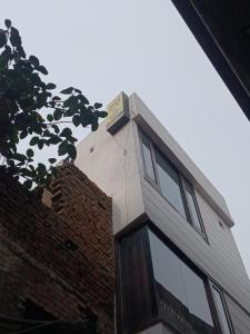 a sign on the top of a building at Agam Homestay-Two Minutes Walk From Golden Temple in Amritsar