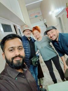 a group of people standing in a room at Agam Homestay-Two Minutes Walk From Golden Temple in Amritsar
