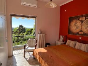 a bedroom with a bed and a window at Vivian Philoxenia in Néa Sampsoús