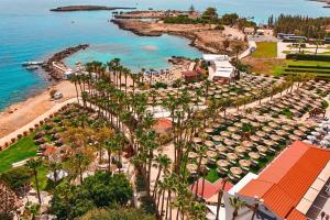 an aerial view of a resort near the ocean at Cavo Maris Beach Hotel & Suites in Protaras
