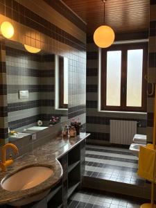 a bathroom with a large sink and a tub at Lungamerenda in Costigliole dʼAsti +89 photos