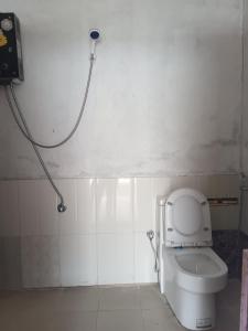 a bathroom with a toilet and a shower at Saura place Homestay in Nagarkot