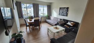 a living room with a couch and a table at Apartment Bergen Central in Bergen