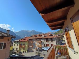 a view of a city from a balcony at Dolomiti Alpine Homes - Appartamento Brenta in Giustino