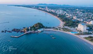 an island in the water next to a beach at Lan Chau Luxury Hotel in Cửa Lô +13 photos