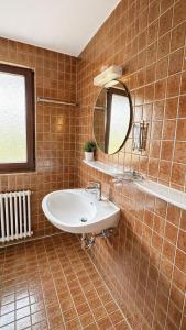 a bathroom with a sink and a mirror at BaB Hotels and Apartments-Zum Letzten G'Stehr in Bad Rippoldsau +34 photos