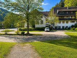 a car parked in front of a building at BaB Hotels and Apartments-Zum Letzten G'Stehr in Bad Rippoldsau