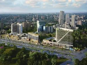 an aerial view of a city with a highway and buildings at Nature Escape Jacuzzi Apartment in Gurgaon