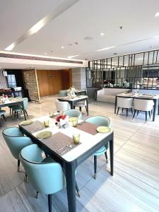 a dining room with a table and chairs at Nature Escape Jacuzzi Apartment in Gurgaon