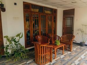 a room with a table and four chairs and a table at kuma holiday resort in Meda-Ela
