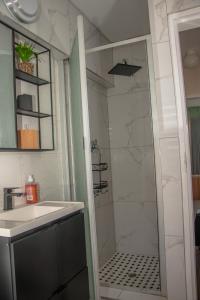 a bathroom with a shower and a sink at Villa Elizabeth - Fourways Gardens Sandton in Fourways +27 photos