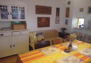 a living room with a table and a couch at Pod kláštorom in Svätý Beňadik