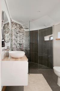 a bathroom with a sink and a shower at Sani Mountain Escape in Mokhotlong +54 photos