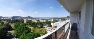 a balcony with a view of a city at Apartmán s balkonem in Most