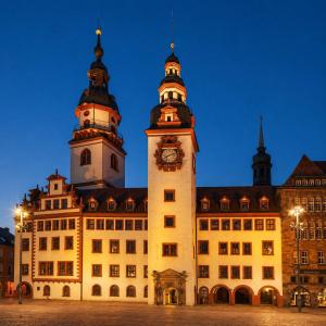 a large building with a clock tower in front of it at BaB Hotels and Apartments Apolo 3 in Chemnitz