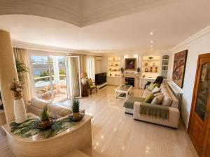 a living room with a couch and a table at Villa Filipinas ,CITY CENTER -ETV10310 in Palma de Mallorca