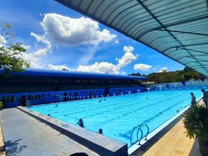 a large swimming pool in a stadium at Ice mango homestay Badulla in Badulla
