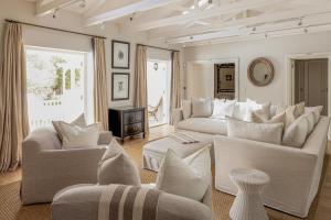 a large living room with couches and a table at Vivere in Hermanus