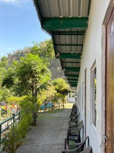 a row of benches sitting on the side of a building at Stay Maasa Resort in Shivpuri