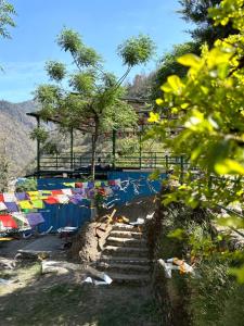 a group of people laying on the stairs at a beach at Stay Maasa Resort in Shivpuri