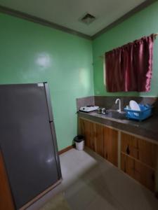 a bathroom with a sink and a shower at JMM Guest House in Panglao Island +12 photos