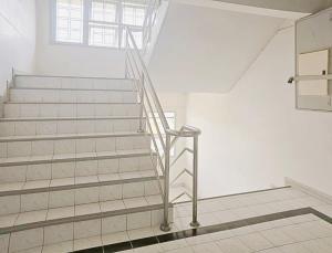 a staircase in a white room with a window at H-Hub BBT in Ban Khlong Yuan +14 photos