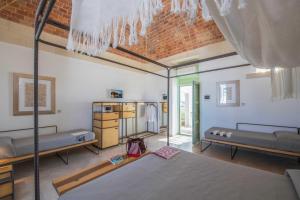 a bedroom with two beds in a room at La Filanda Salento in Casamassella