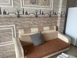 a rendering of a couch with a pillow on it at Lami House in Danang