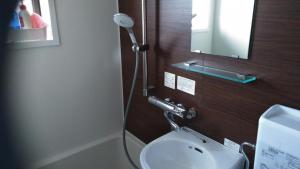 a bathroom with a white toilet with a shower at Minpaku Nambu in Koka +26 photos