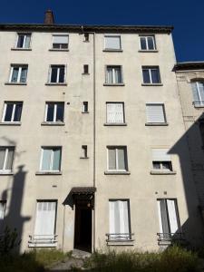 an old building with a door in front of it at Studio cosy proche transports in Aulnay-sous-Bois