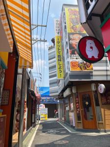 an alley of buildings with signs on them at 529 Cozy rooms in Ban Si Than