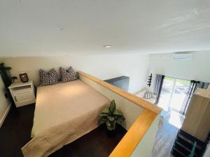 a room with a bed and a staircase at 2 Modern guesthouses near The Beach in Falkenberg