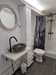 a bathroom with a sink and a toilet at Fachwerkstube in Witzenhausen +20 photos